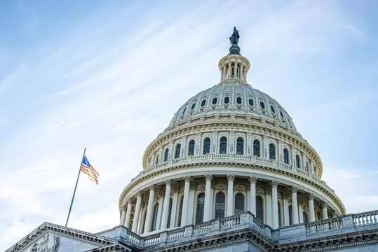 The US Congress building with the US flag