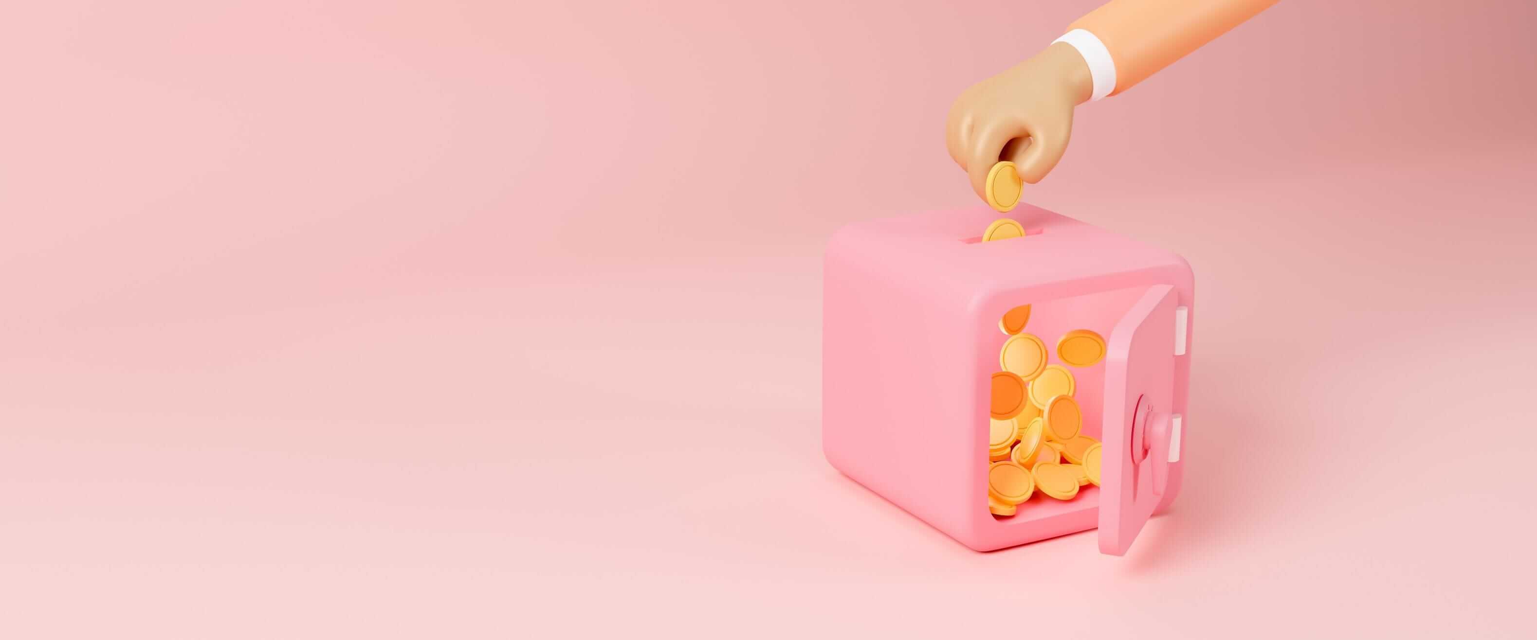 a hand inserts gold coins into a pink safe on a pink background a hand inserts gold coins into a pink safe on a pink background